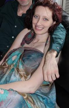 Me in May 2013, 5 months pregnant, with my then-husband just out of view. I looked happy and put on a good show.